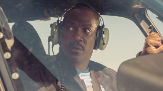 Axel Foley (Eddie Murphy) talks to Bobby Abbott in a helicopter in Beverly Hills Cop: Axel F