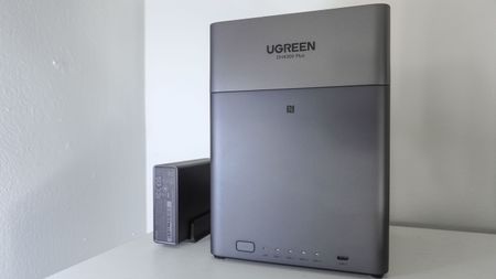 The Ugreen US3000 mini UPS next to a Ugreen NAS on a shelf