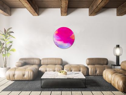A living room featuring a large circular resin mirror