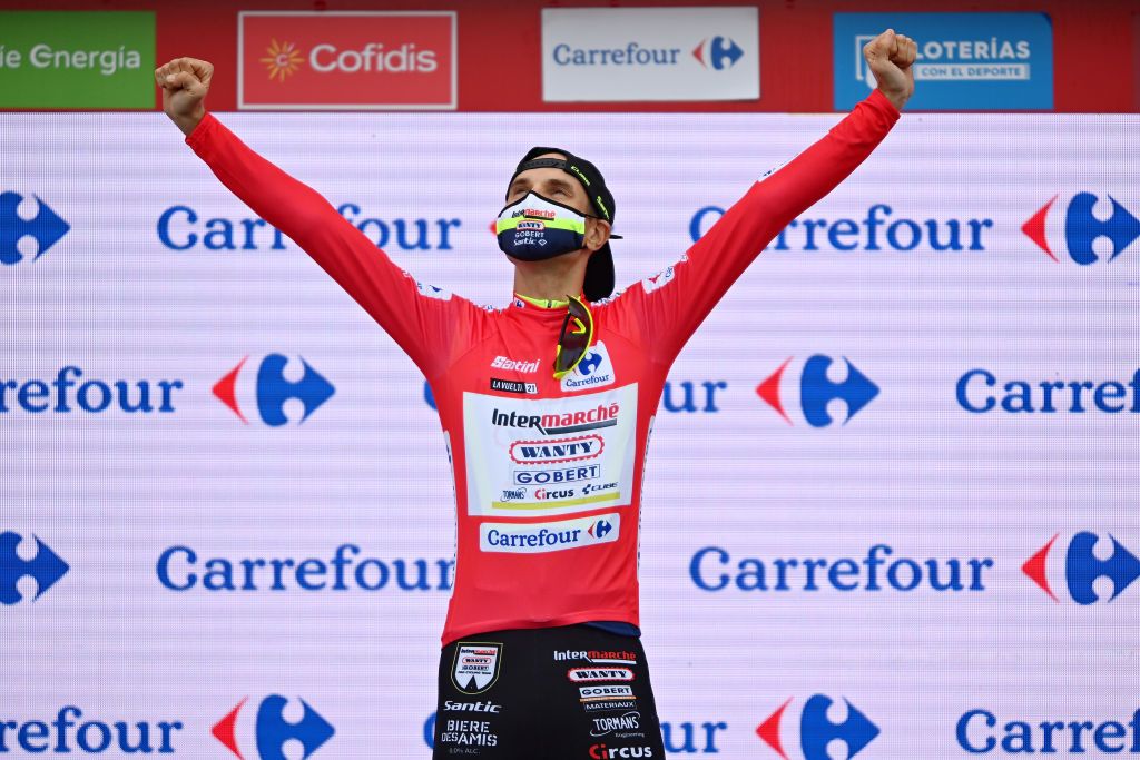 ESPINOSA DE LOS MONTEROS SPAIN AUGUST 16 Rein Taarame of Estonia and Team Intermarch Wanty Gobert Matriaux celebrates winning the red leader jersey on the podium ceremony after the 76th Tour of Spain 2021 Stage 3 a 2028km stage from Santo Domingo de Silos to Espinosa de los Monteros Picn Blanco 1485m lavuelta LaVuelta21 CapitalMundialdelCiclismo on August 16 2021 in Espinosa de los Monteros Spain Photo by Stuart FranklinGetty Images