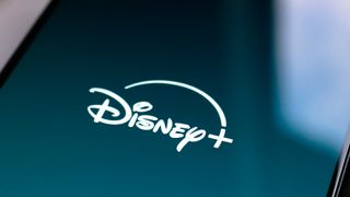 Disney logo and branding pictured on a smartphone screen.