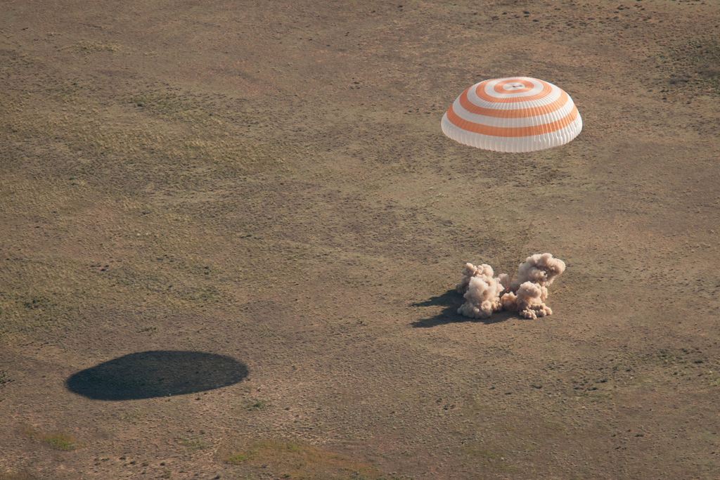 The Soyuz TMA-20 spacecraft is seen as it lands with Expedition 27 Commander Dmitry Kondratyev and Flight Engineers Paolo Nespoli and Cady Coleman in a remote area southeast of the town of Zhezkazgan, Kazakhstan, on Tuesday, May 24, 2011