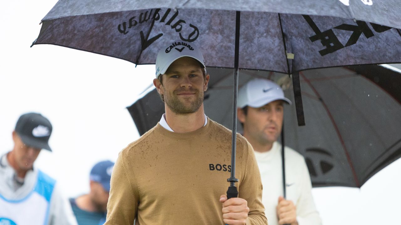 Thomas Detry carrying an umbrella at he AT&amp;T Pebble Beach Pro-Am