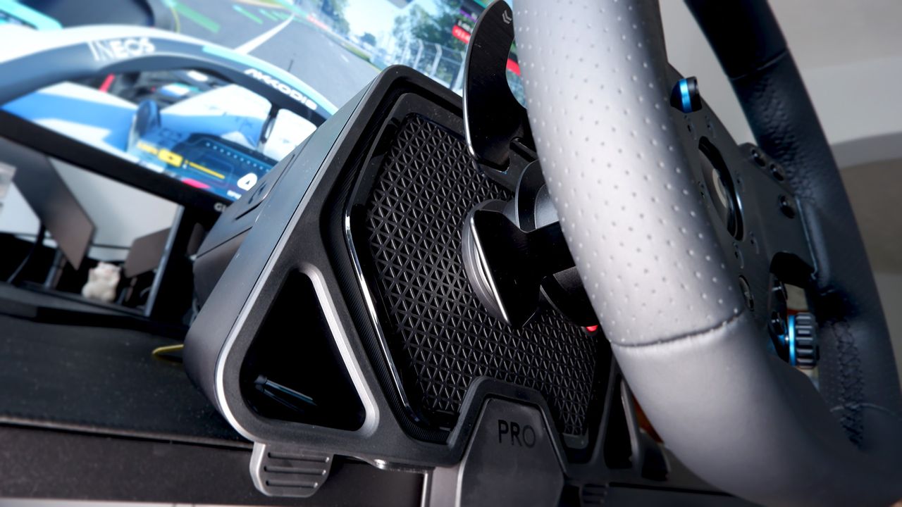 Logitech G Pro Racing Wheel and Pedals installed on a computer desk