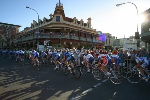 The peloton rides past the Stag Hotel