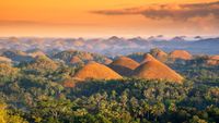 View of the Chocolate Hills at sunset.