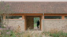 Wraxall Yard exterior with man standing at the entrance