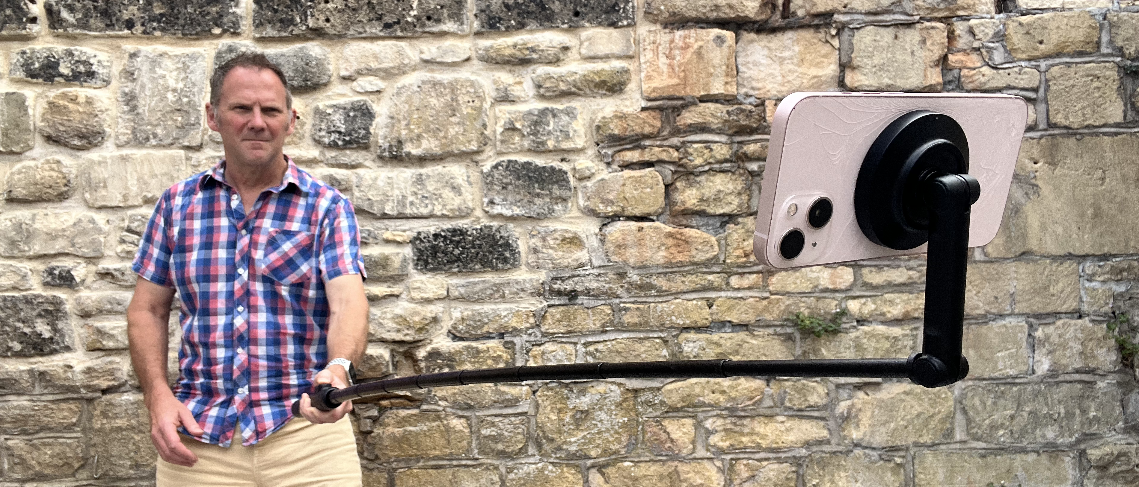 Man holding KraftGeek JustTap Magnetic Phone Tripod as a Selfie Stick