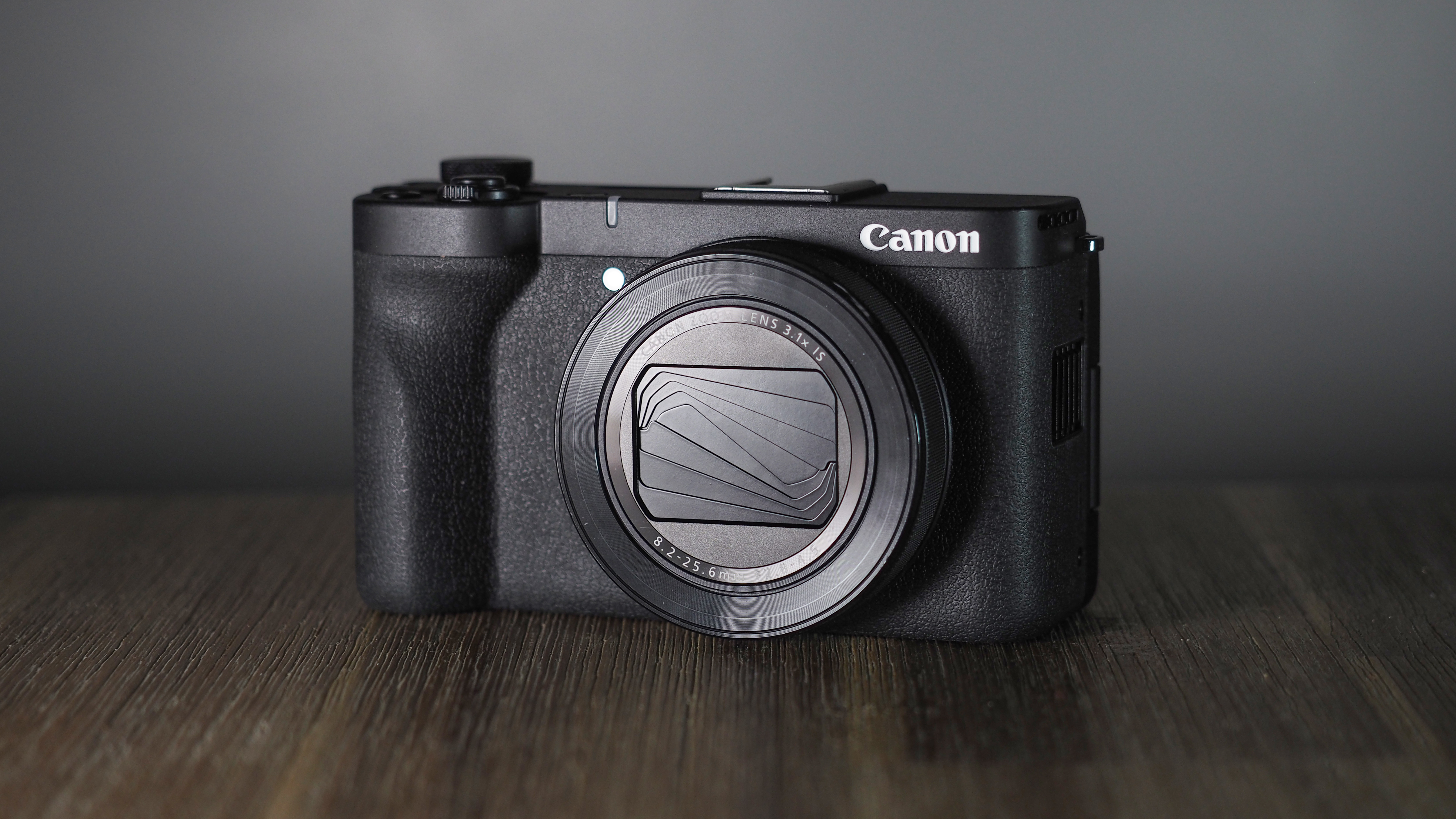 Canon PowerShot V1 on a wooden surface