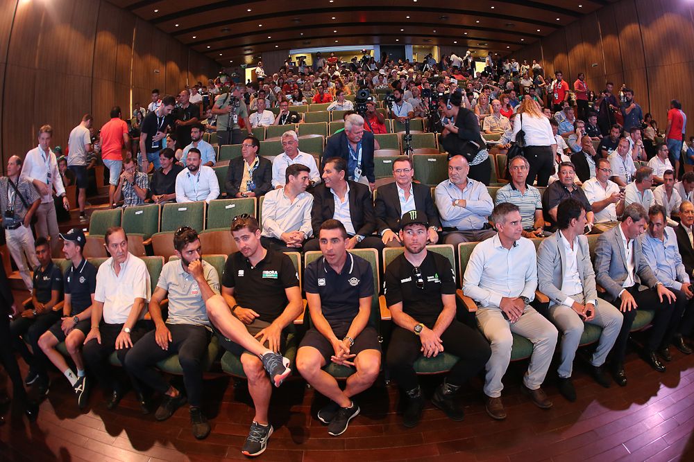 Riders and spectators wait for the start of the Vuelta a San Juan
