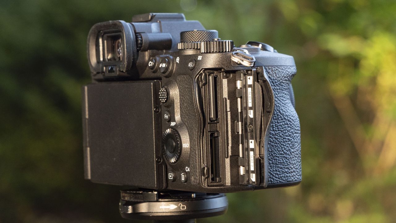 Closeup of the Sony A7R VI camera's memory card door, its open