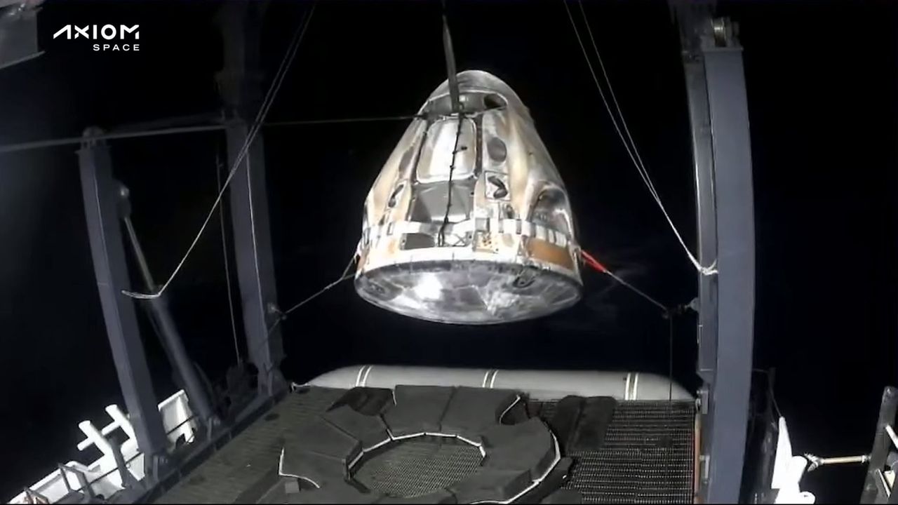 SpaceX Dragon capsule Freedom being hoisted aboard a recovery ship after Ax-2 astronaut splashdown