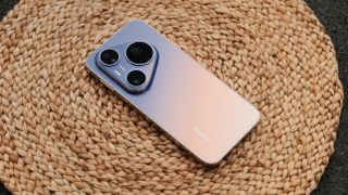 Huawei Pura90s Pro Max smartphone on a brown mat