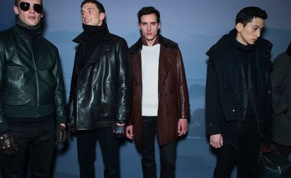 Four models stood side by side in coats