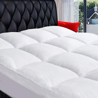 COONP Queen Mattress Topper on a bed.