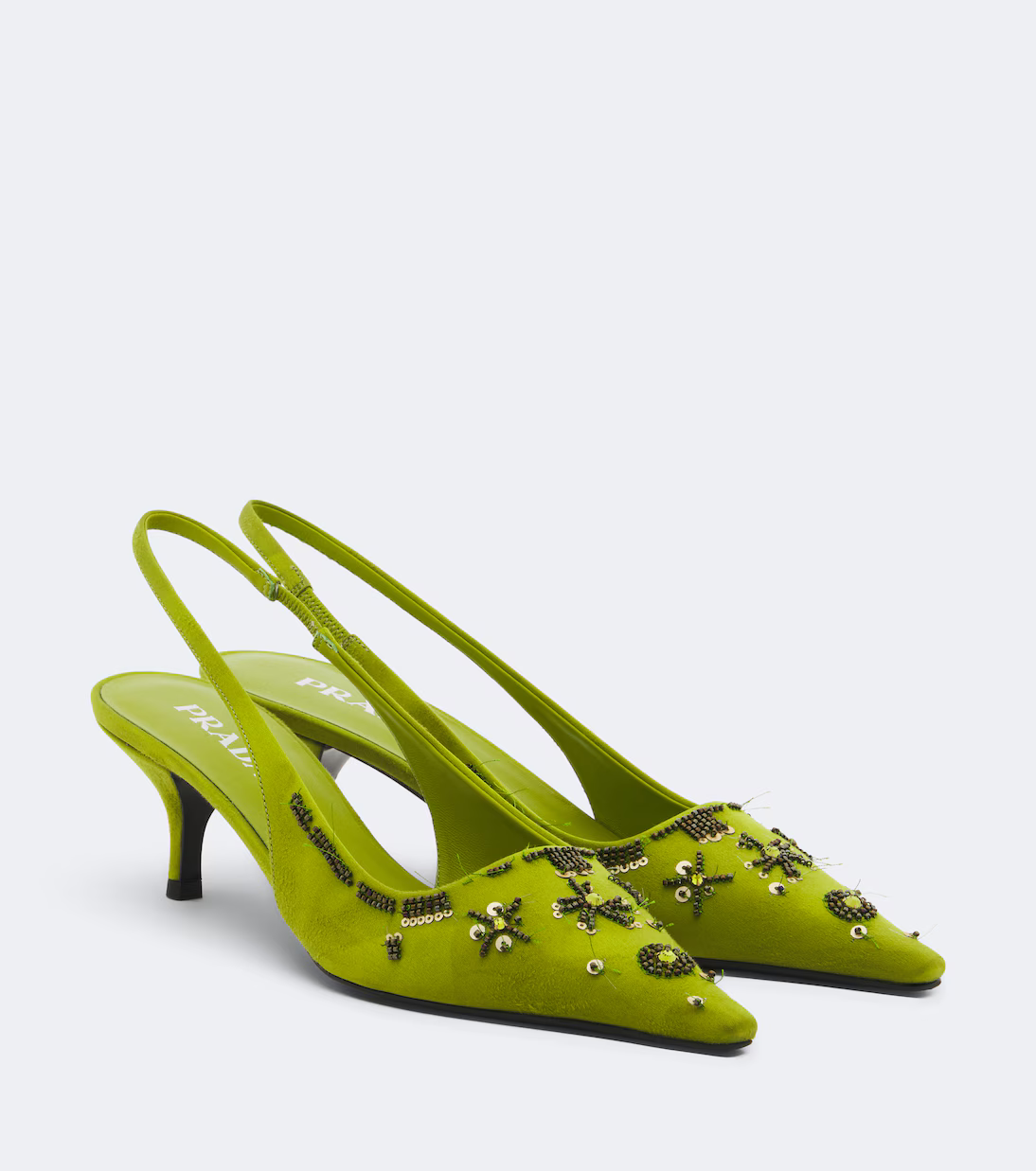 A pair of satin green Prada slingbacks.