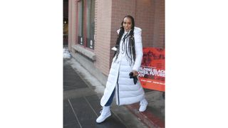 Kerry Washington wearing white parka coat