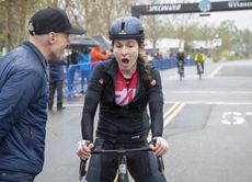 Lauren De Crescenzo reacts to winning inaugural The Growler road race at the finish, greeted by race founder Levi Leipheimer