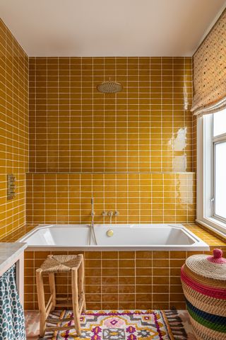 a yellow tiled bathroom