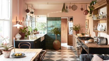 rustic pink kitchen with chequerboard floor