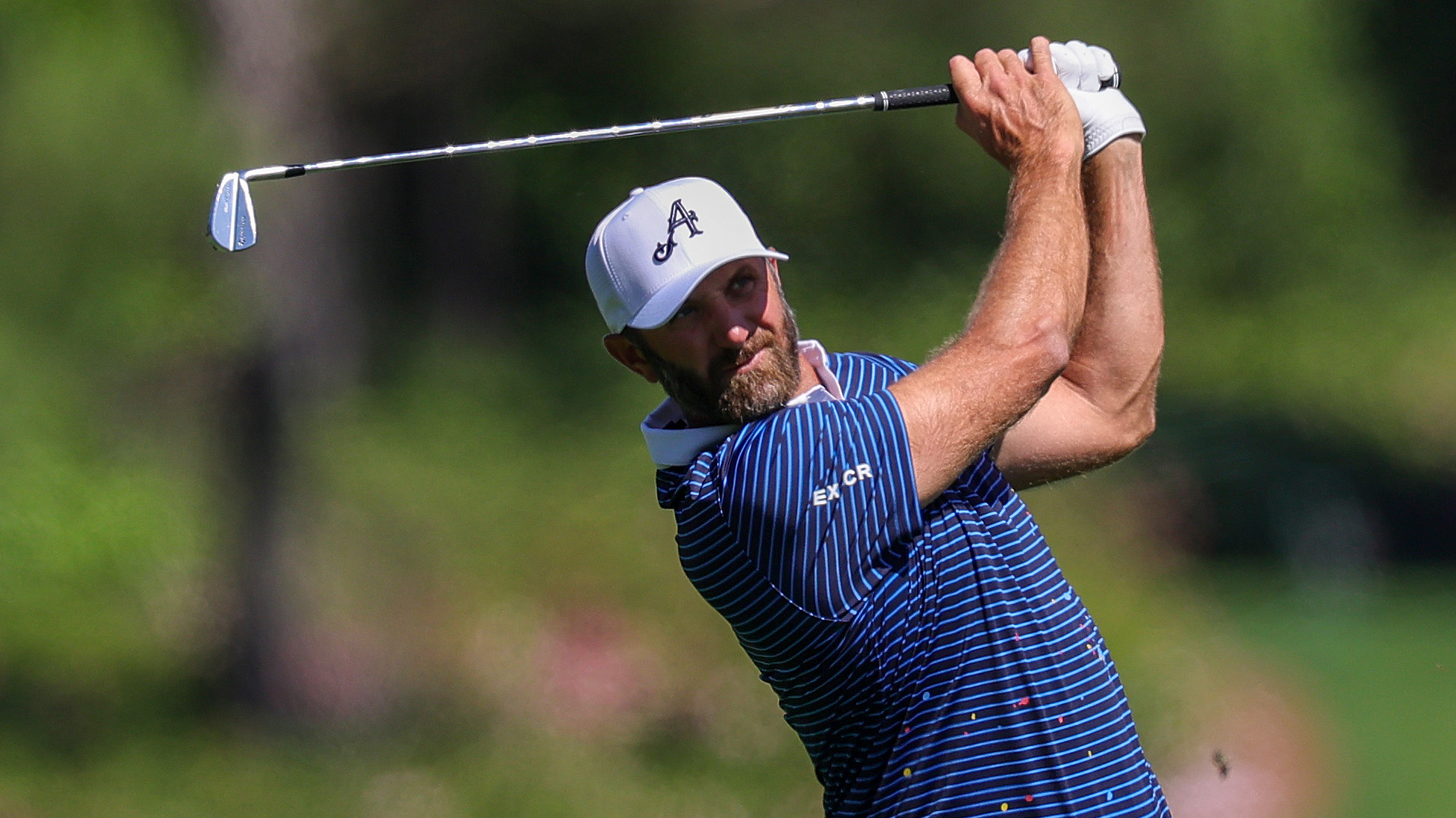 Photo of Dustin Johnson hitting an iron