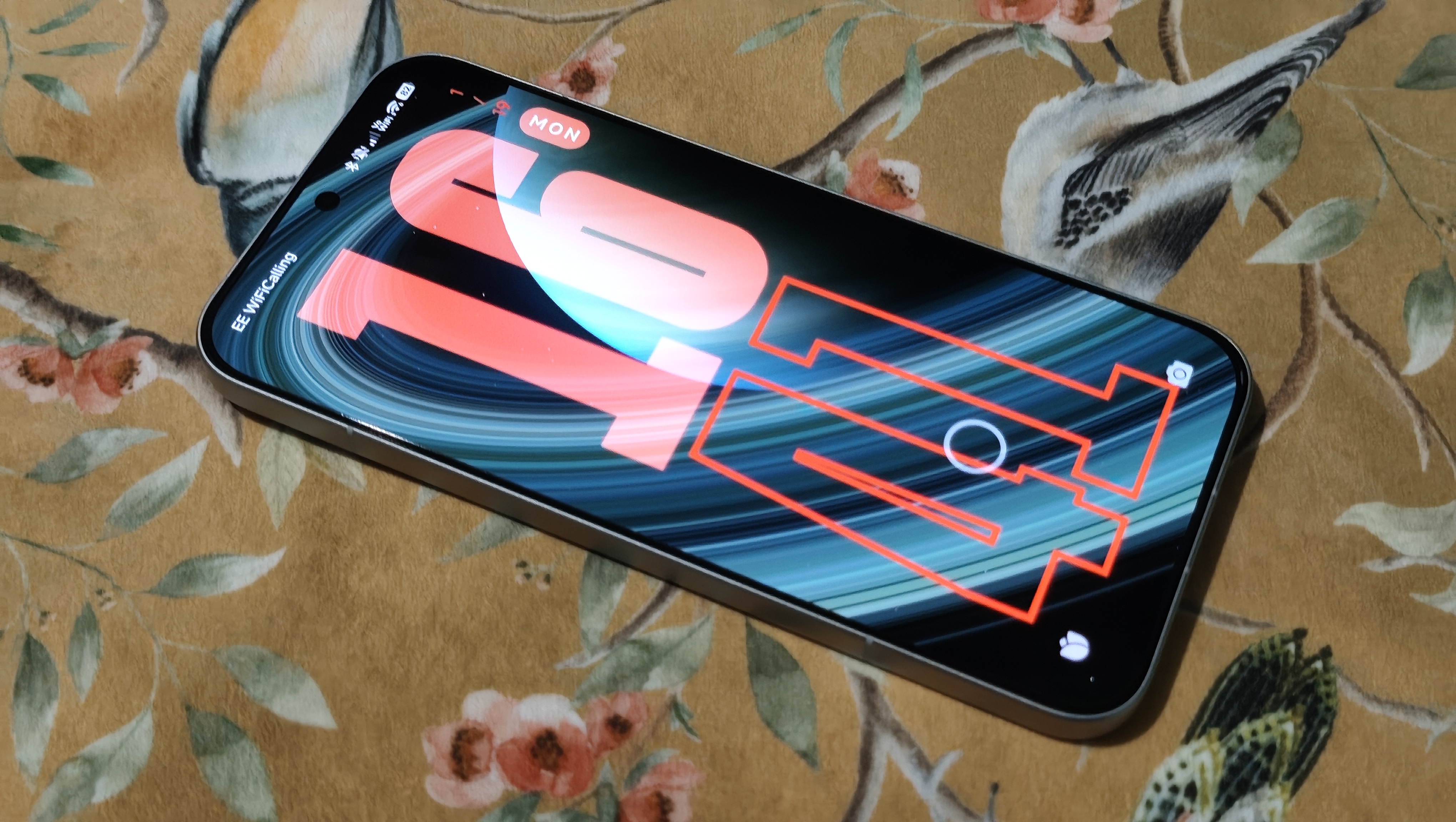 A Poco F8 Ultra on a flower-decorated pillow