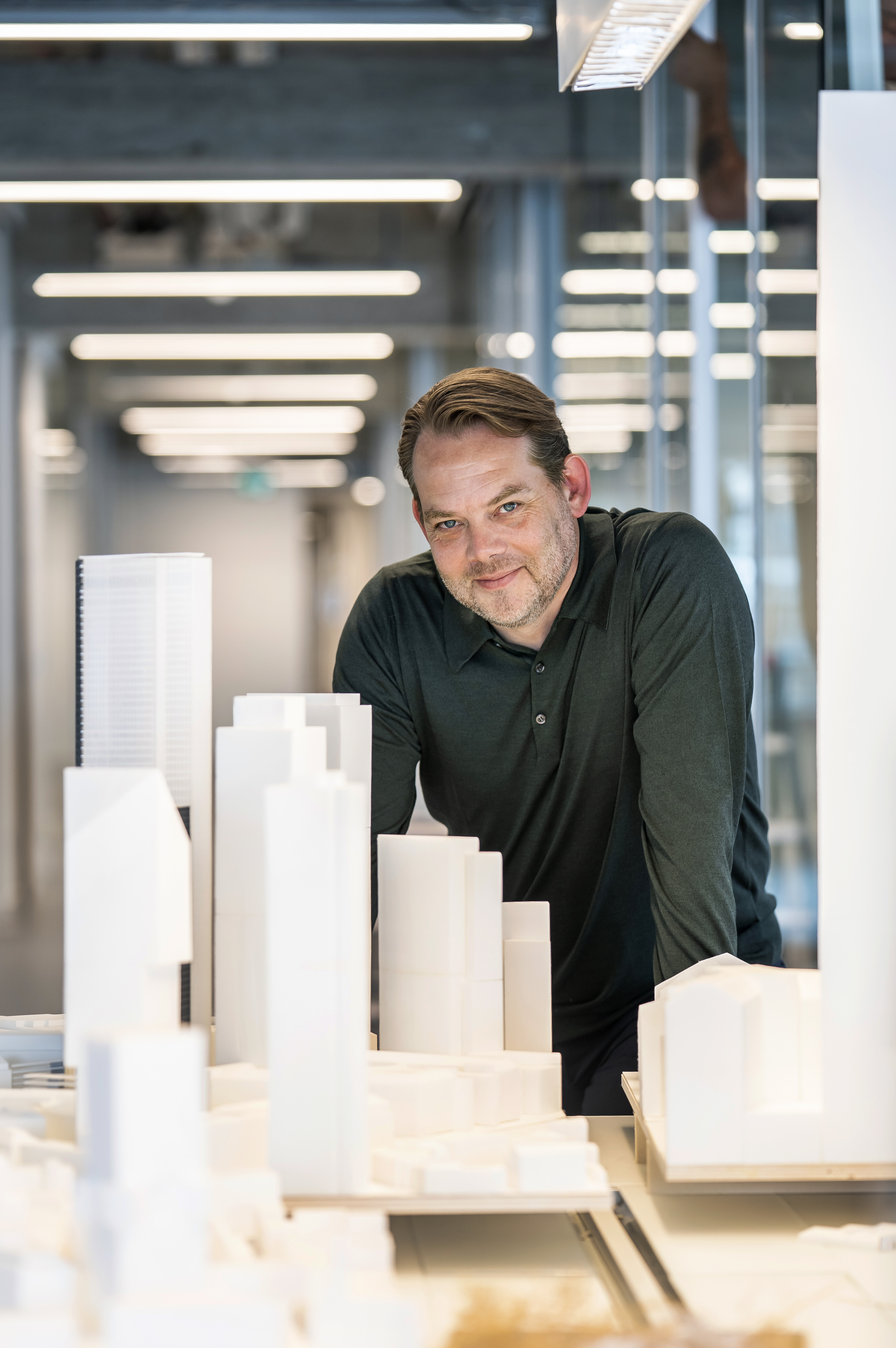 portrait of David Gianotten next to an architectural model