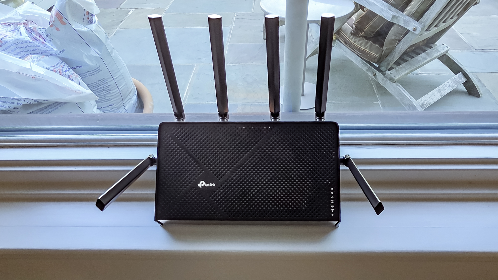 TP-Link Archer BE9700 on a windowsill