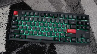 Lemokey L4 gaming keyboard on a carpet with lighting enabled.