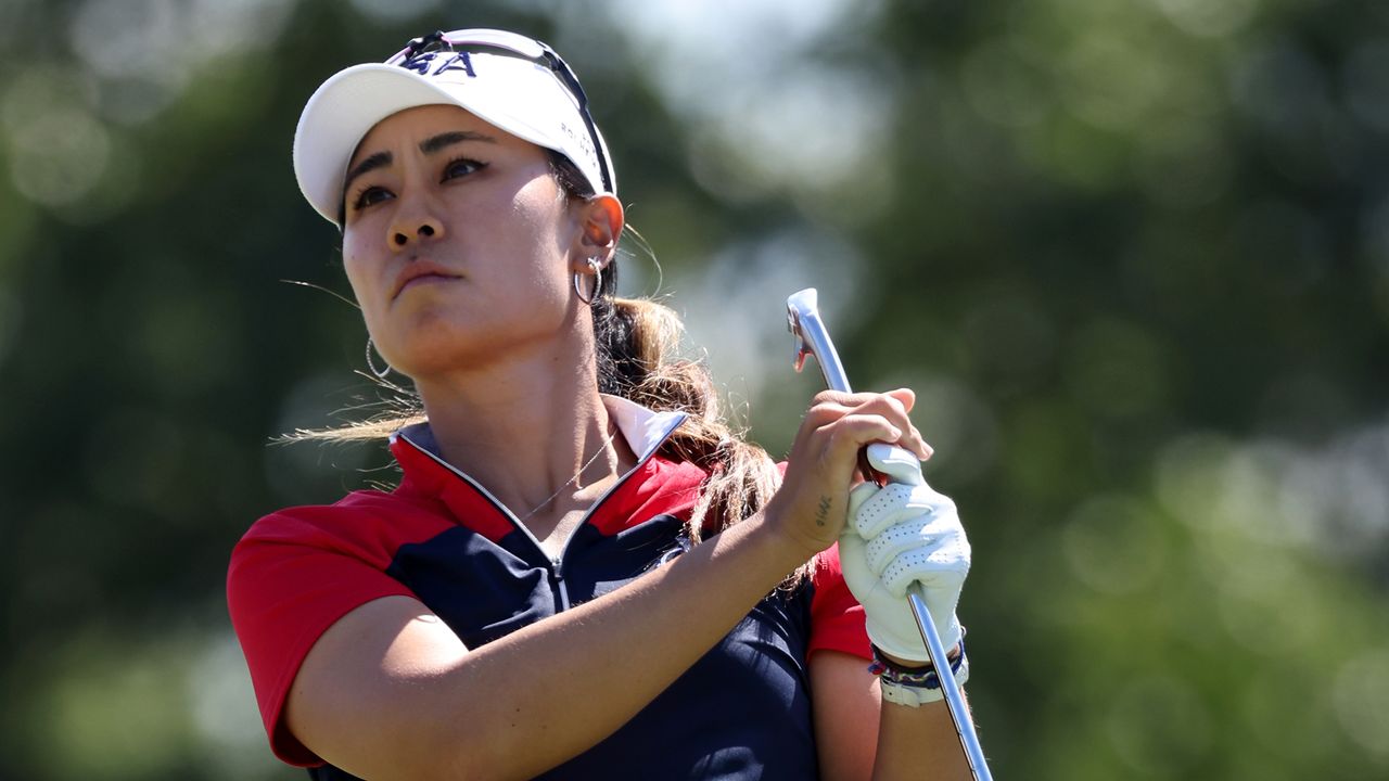 Danielle Kang plays an iron shot