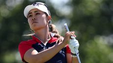 Danielle Kang plays an iron shot