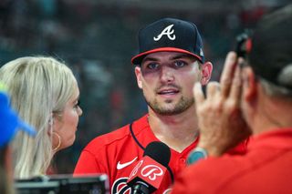 Bally Sports reporter Kelly Crul interviews Austin Riley of the Atlanta Braves following a 2022 game. 