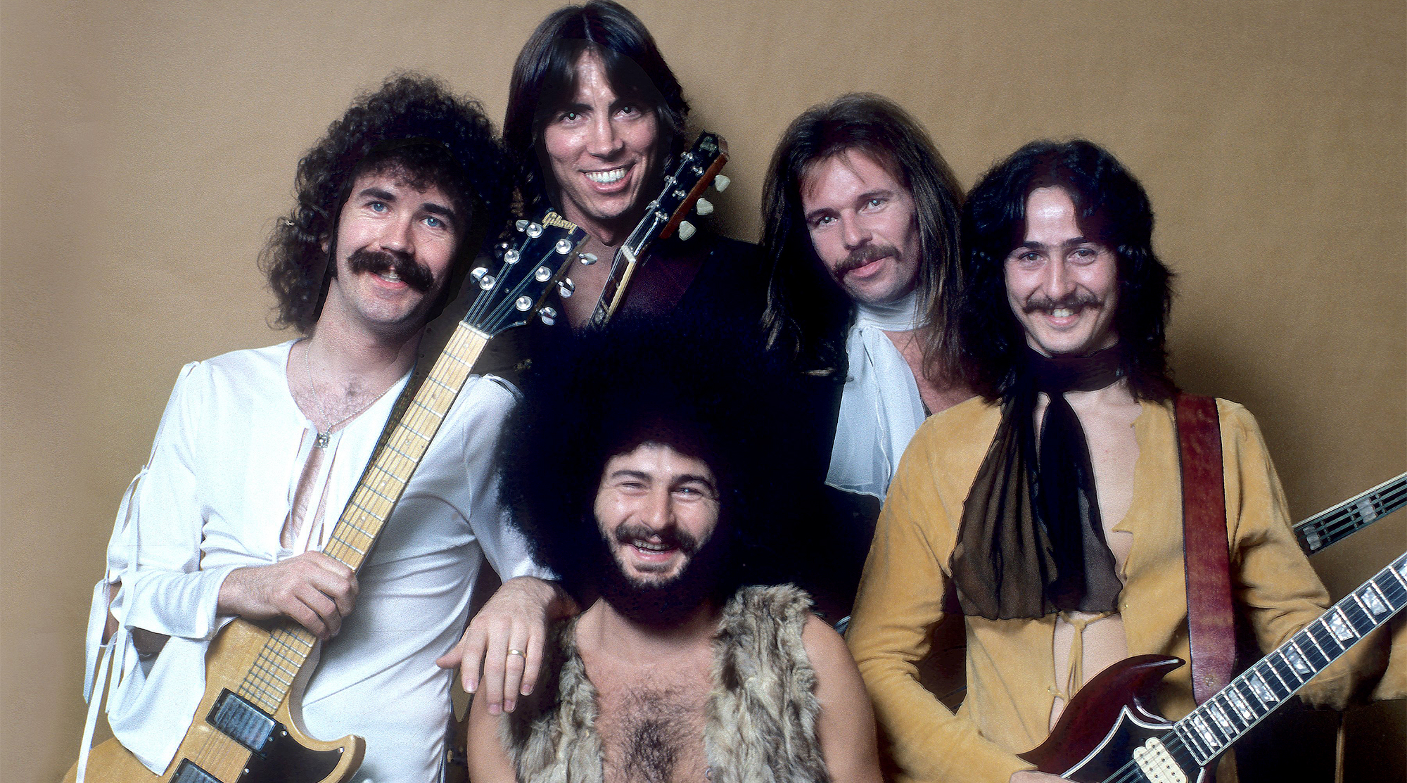 Boston pose for a portrait backstage at the Providence, Rhode Island Civic Center, October 7, 1976. (from left) Brad Delp, Tom Scholz, Sib Hashian, Fran Sheehan and Barry Goudreau.