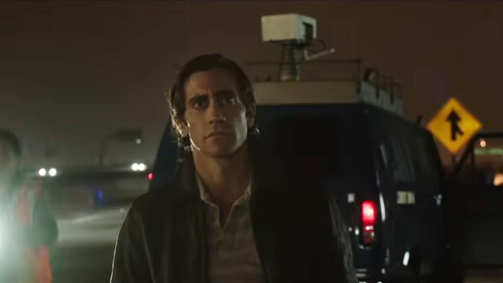 Jake Gyllenhaal in front of a car in Nightcrawler.