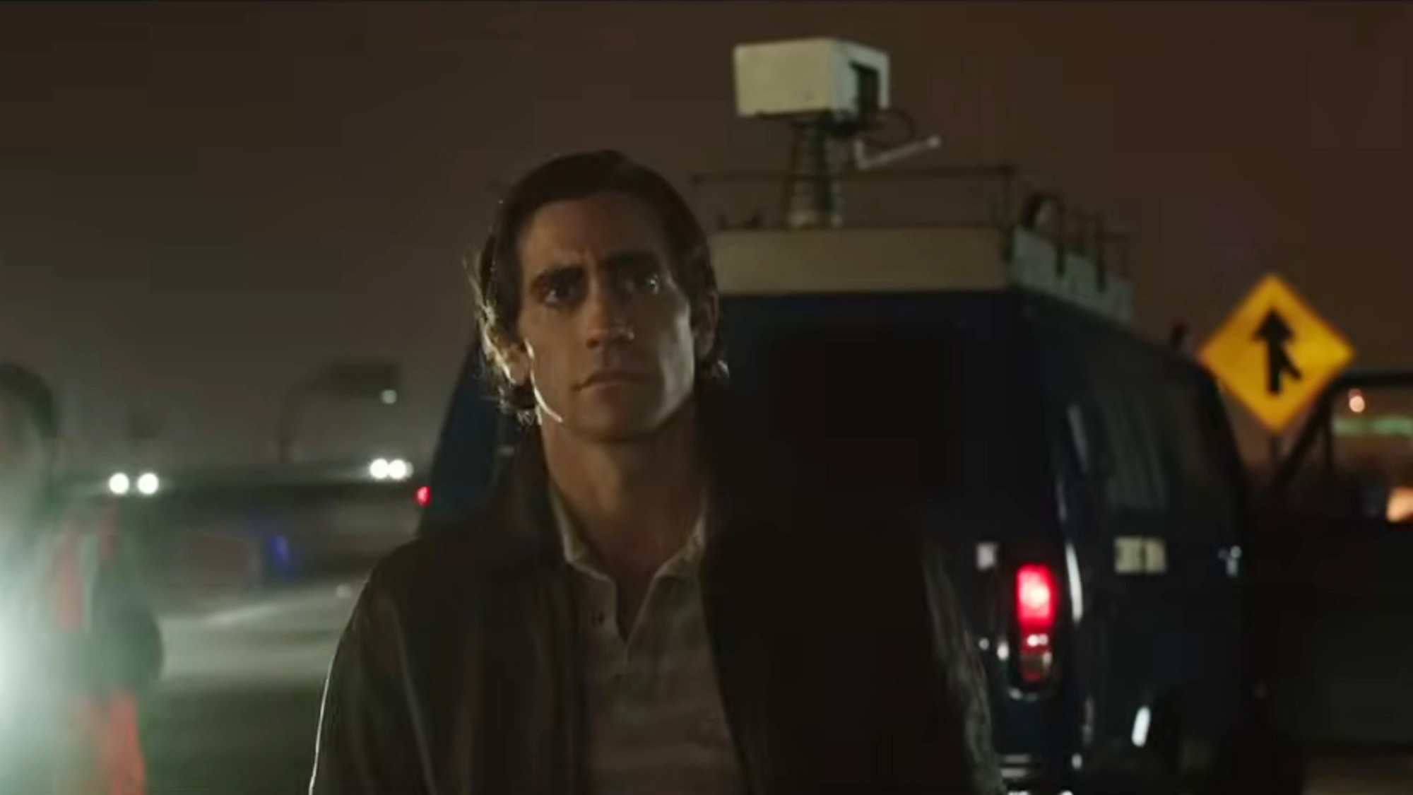 Jake Gyllenhaal in front of a car in Nightcrawler.