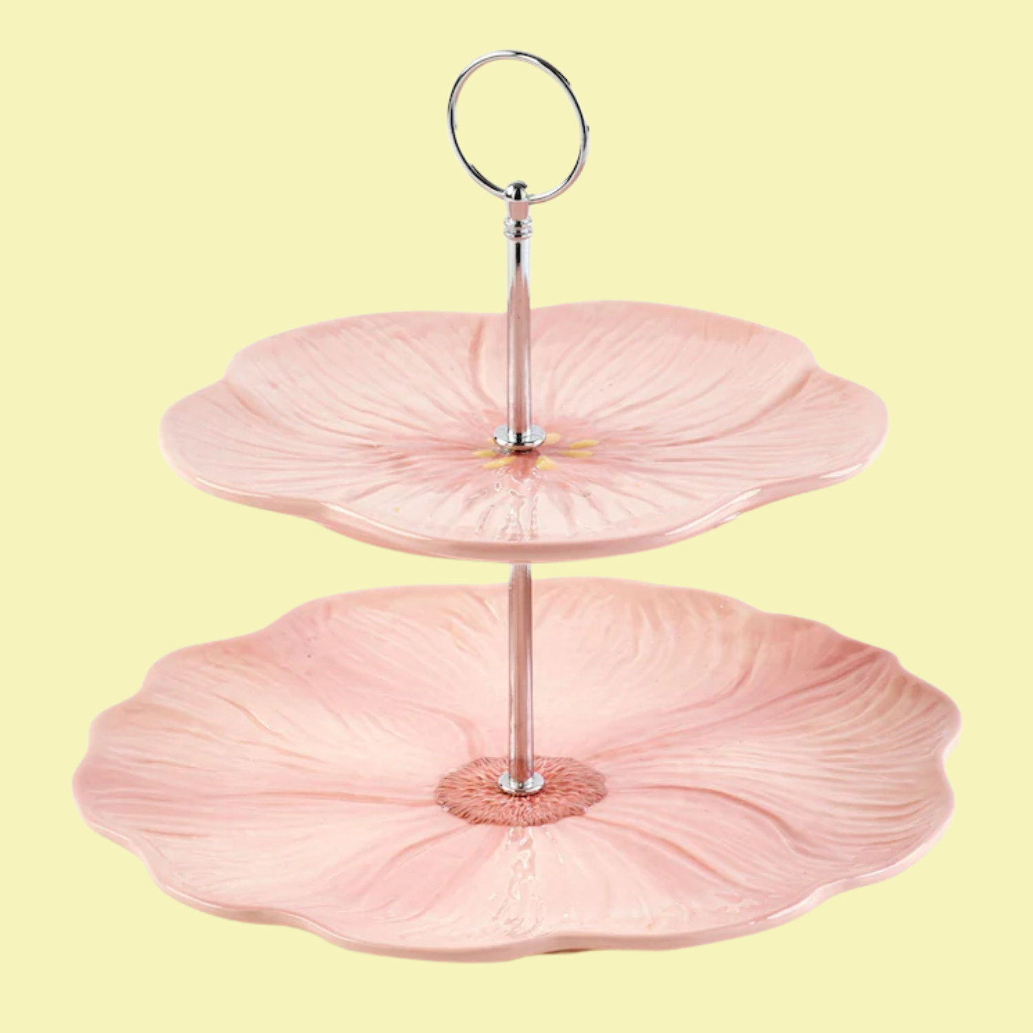 A two-tiered peach floral cake stand