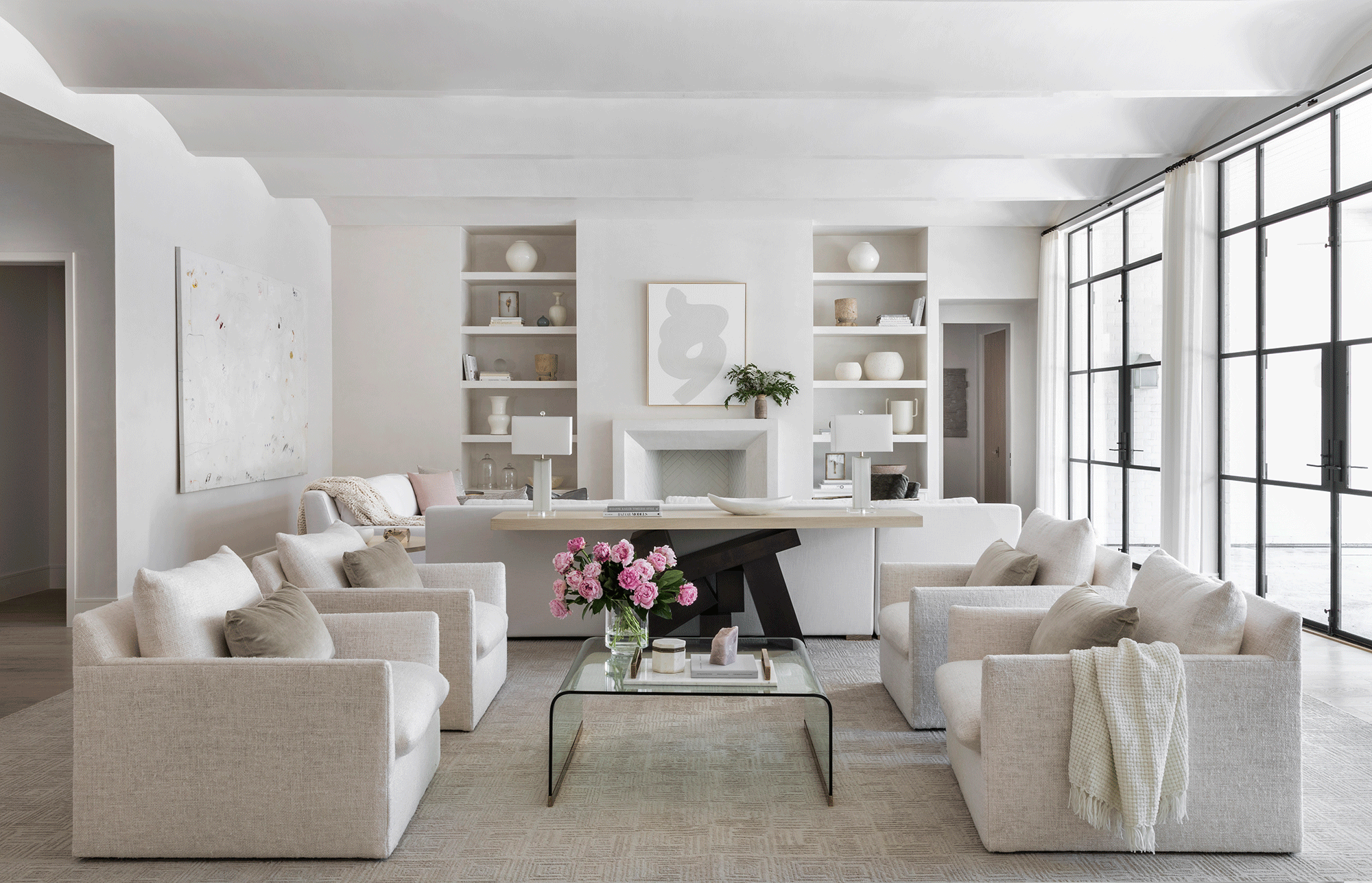 Ceiling molding has been used to create an interesting 3D effect in the living room