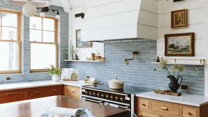 blue kitchen with tiles and wooden cabinetry