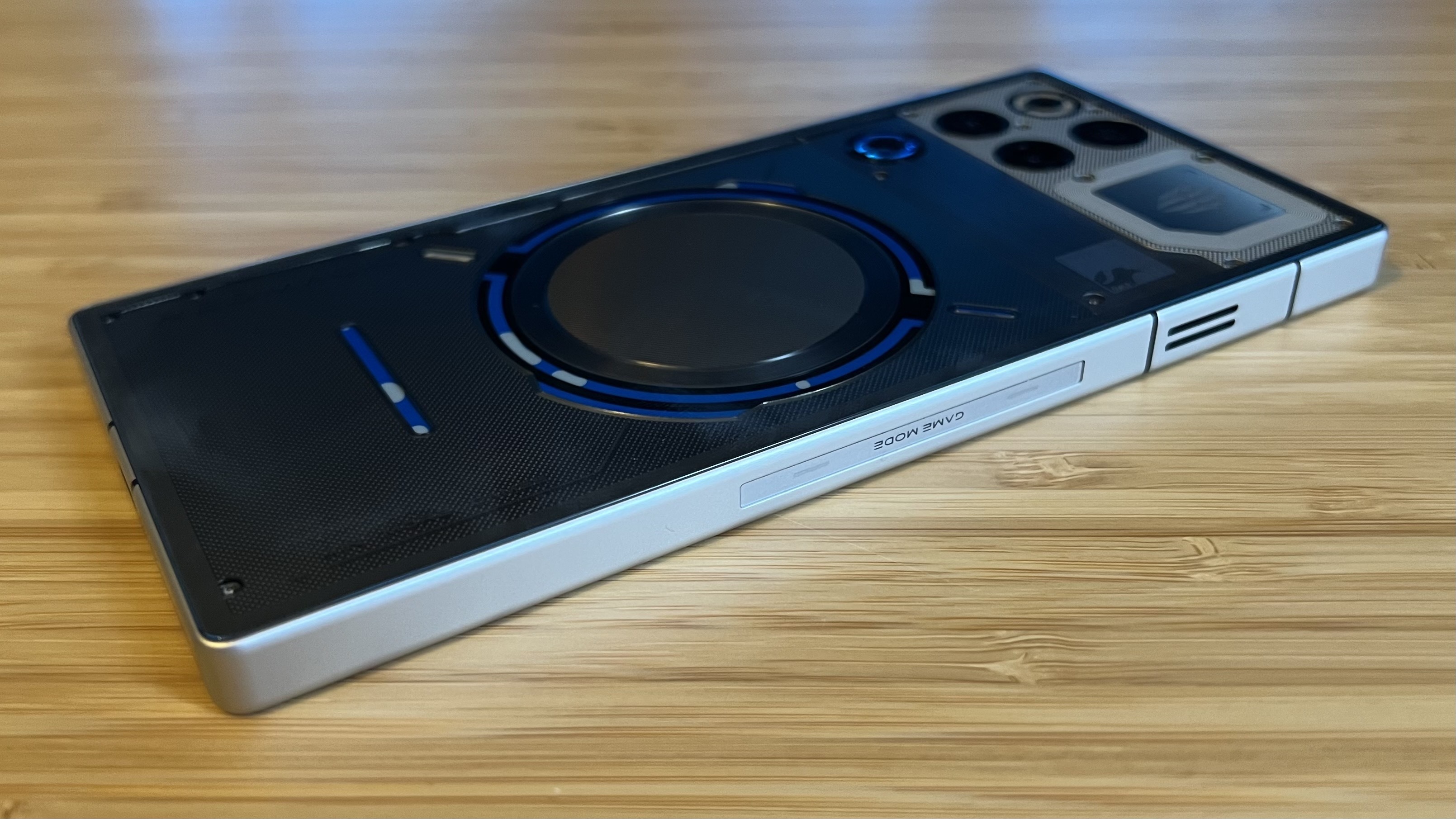 RedMagic 11 Pro gaming phone face down on a wooden desk