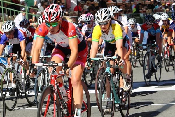 The bunch passes through the start - finish area with a lap to go was still hidden in the bunch with one lap to go