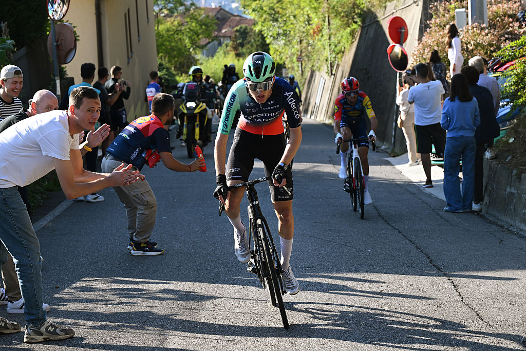 Seixas out of the saddle with fans cheering and Ciccone trailing