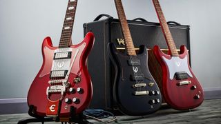 A trio of Epiphone electric guitars, including (L-R) an Epiphone Crestwood Custom, Epiphone Wilshire and Epiphone Coronet