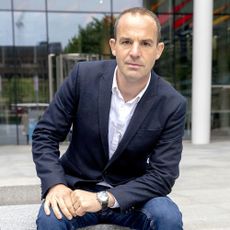 Martin Lewis in white shirt with blue blazer and leather strap wristwatch