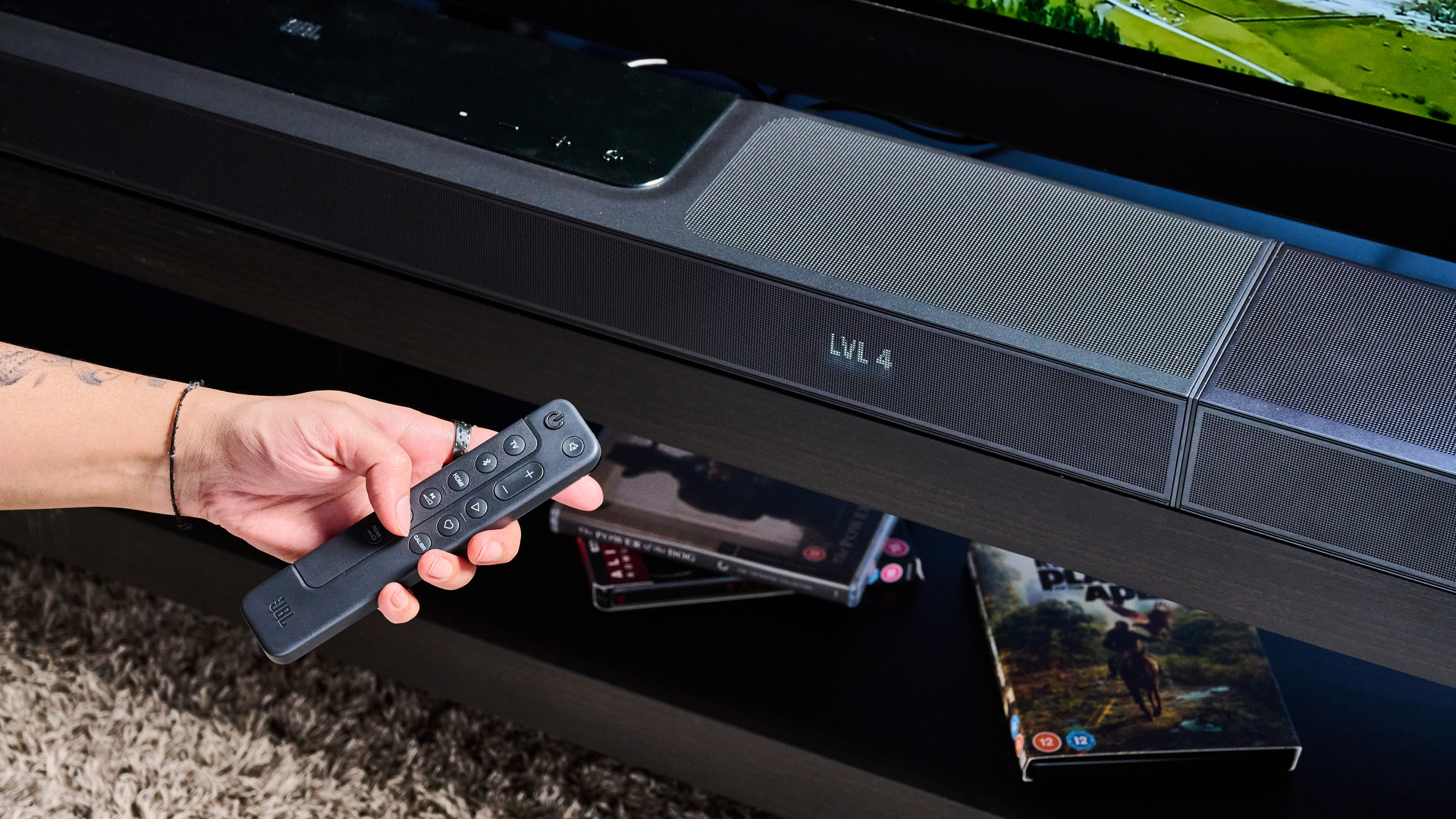 the jbl bar 1300x a black soundbar with HDMI ports, two surround channel speakers, a subwoofer wirelessly connected