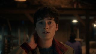 Will Byers looking scared in a barn in Stranger Things Season 5x04