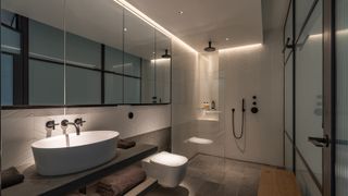 LED strip lighting scheme in contemporary bathroom