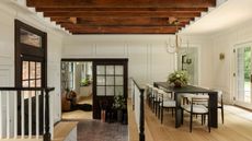 carriage house beamed dining room black table