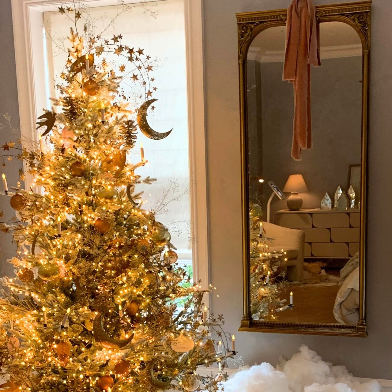 Anthropologie Holiday House bedroom with a mirror and christmas tree