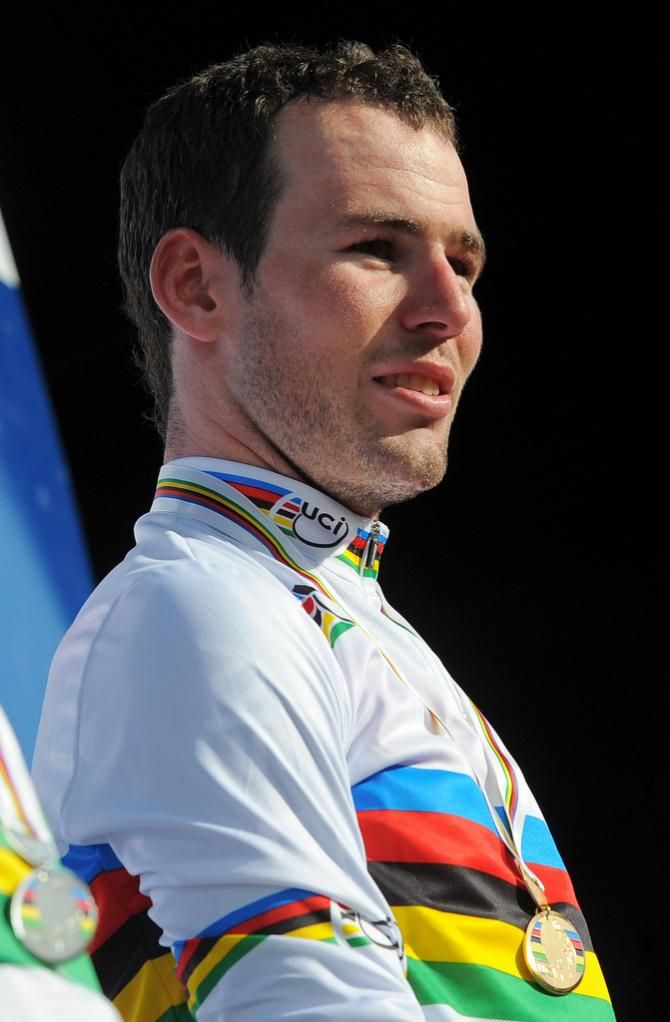 Mark Cavendish (Great Britain) on the podium after collecting the rainbow jersey