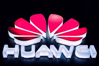 The Huawei logo in lights